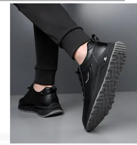 Detail shot of black leather sneaker sole with non-slip texture and fashion logo