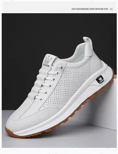 Detail of white casual sneaker showing breathable perforated upper and gum rubber outsole