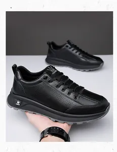 Macro detail of breathable perforated leather and M Fashion logo on men's black sneakers