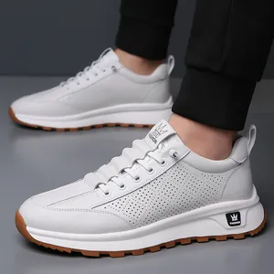 Men's white casual sneakers with breathable perforated sides and brown rubber gum sole
