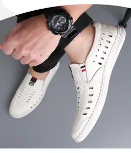 Detail of white leather men's summer loafer showing breathable cut-outs and fine stitching