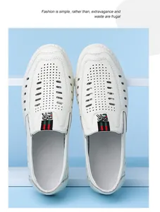 Detail of white hollowed leather loafers with red-green ribbon and breathable design