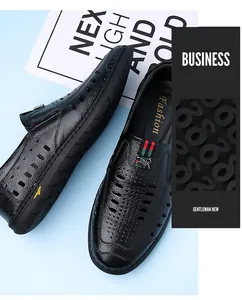 Detailed close-up of men's breathable hollow leather shoes with red and green stripe webbing