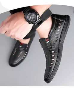 Detail of men's breathable black leather loafers with hollow cut-outs and stripe accents