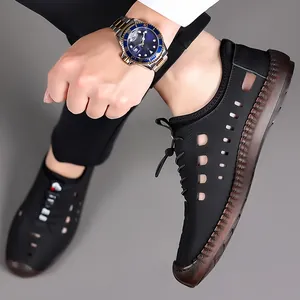 Chaussures décontractées homme en cuir noir ajouré avec semelles marron antidérapantes