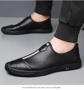 Detailed view of black leather loafers for men with breathable side perforations