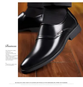 Detail of classic black leather business shoes featuring elegant side perforation patterns