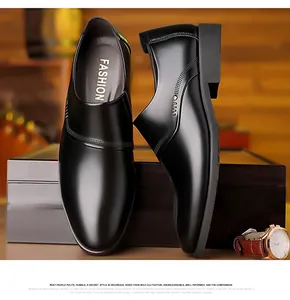 Detailed macro view of black polished leather dress shoe with elegant side perforations