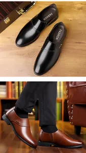 Detail of slip-on business shoes showing perforated craft in black and brown leather
