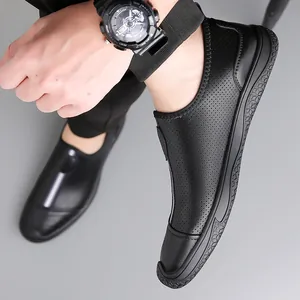 Men's black perforated leather slip-on shoes with breathable hollow design and rubber soles