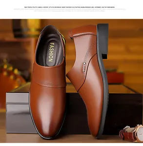 Close-up of brown business shoes with refined stitching, punch details and metal rivets
