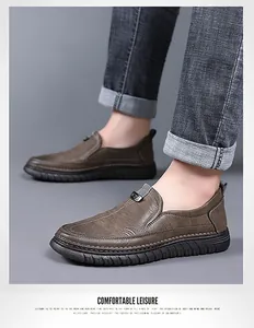 Detail of dark brown leather loafer featuring hidden elastic bands and non-slip rubber sole