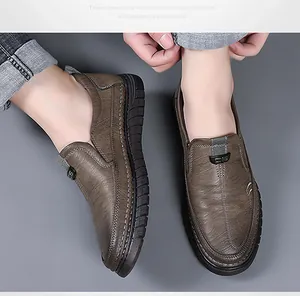 Close-up of pebble grain leather texture and durable hand-stitched seams on men's loafers