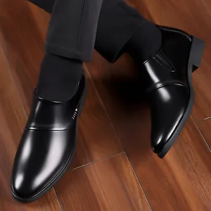 Polished black leather men's slip-on formal business shoes with decorative punch lines