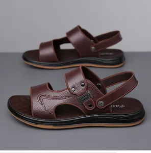 Detail of premium brown leather sandals with lychee texture and breathable side cutouts