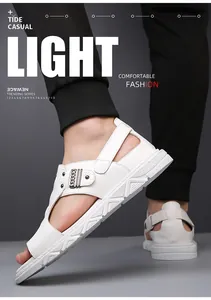 Detail of white leather beach sandal featuring metal chain buckle and thick non-slip sole