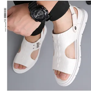 Detailed top view of white crocodile pattern leather sandals with adjustable heel straps