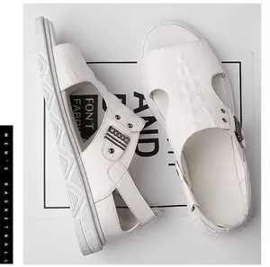 Close-up of white leather sandals with crocodile texture and retro metal chain buckle