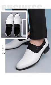 Detailed close-up of men's black and white business shoes with side metal buckle accents