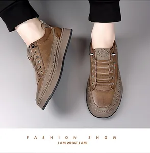 Detail of brown leather casual shoe featuring green and red striped webbing and thick sole