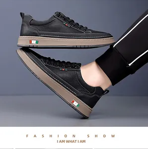 Close-up of black pebble leather men's sneakers with signature tricolor stripe details