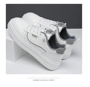 Detail of white sneakers with fashion label, thick rubber sole, and breathable toe box