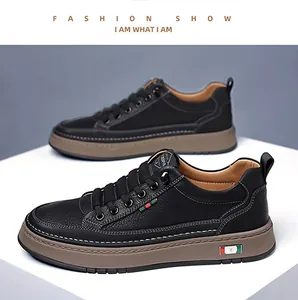 Detailed macro view of black pebble grain leather and durable brown rubber sole