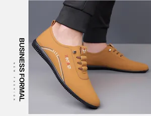 Close-up of brown leather casual loafers for men featuring non-slip rubber soles on feet