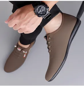 Detail of coffee brown slip-on loafers showing elastic laces and anti-slip rubber sole