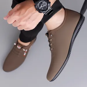 Brown slip-on men's casual leather shoes with breathable soft sole and non-slip black bottom