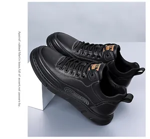 Detail of black pebbled leather high-top shoes with IDE logo and fashion sole design