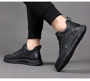 Detail view of black high-top sneakers with FASHION embossing and thick non-slip soles