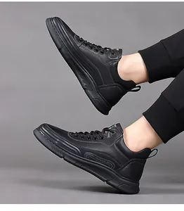 Close-up of black high-top sneakers with lychee texture leather and fashion text detail