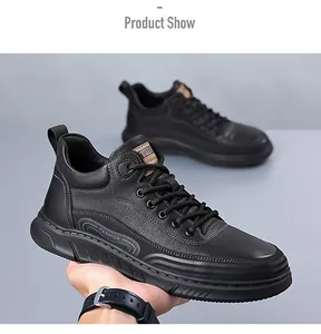 Close-up of black litchi grain leather men's sneakers with fashion text on rubber sole
