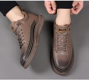 Detailed top view of taupe high-top men's sneakers with black side waves and tide logo