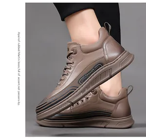Detailed side view of brown high-top casual boots with rubber sole and fashion stitching