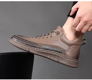 Close-up of khaki leather casual high-top shoes featuring black stripes and fashion text