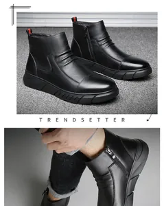 Détail de bottines en cuir noir pour hommes avec fermeture éclair et languette rouge
