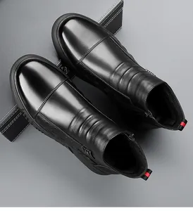 Detail view of black leather boots with side zipper and striped pull tab accents