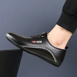 Men's black slip-on casual leather loafers with breathable soft sole and side logo detail