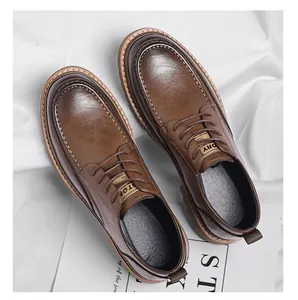 Detail view of brown leather brogue shoes with handmade white stitching and rubber soles