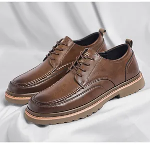 Macro shot of brown leather texture and stitching on British style brogue shoes