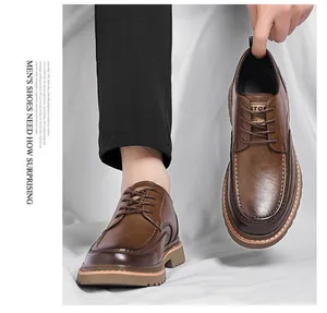 Detail of dark brown leather brogue shoes with thick stitching and anti-slip sole