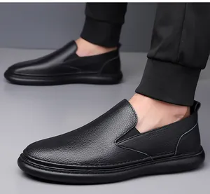 Close-up of black leather loafer showing grain texture and elastic side gussets