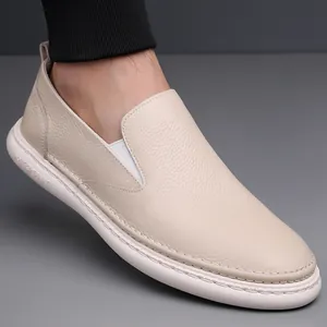Beige men's slip-on loafers in lychee grain leather with white thick rubber soles