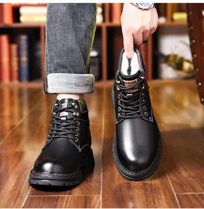 Close-up of black leather high-top boots with warm faux wool lining and contrast stitching