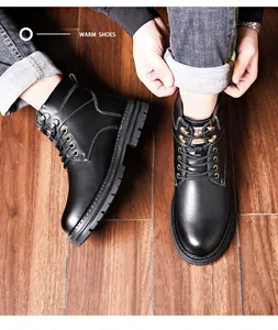Close-up of men's winter boots featuring premium black leather and non-slip rubber soles