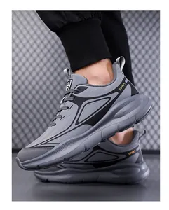 Dynamic side view of men's breathable grey running shoes with durable thick soles
