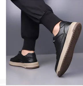 Close-up of men's retro black leather sneakers with durable thick beige rubber soles