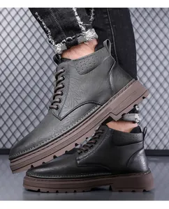 Detail of high-top men's winter boots with leather texture and non-slip thick soles